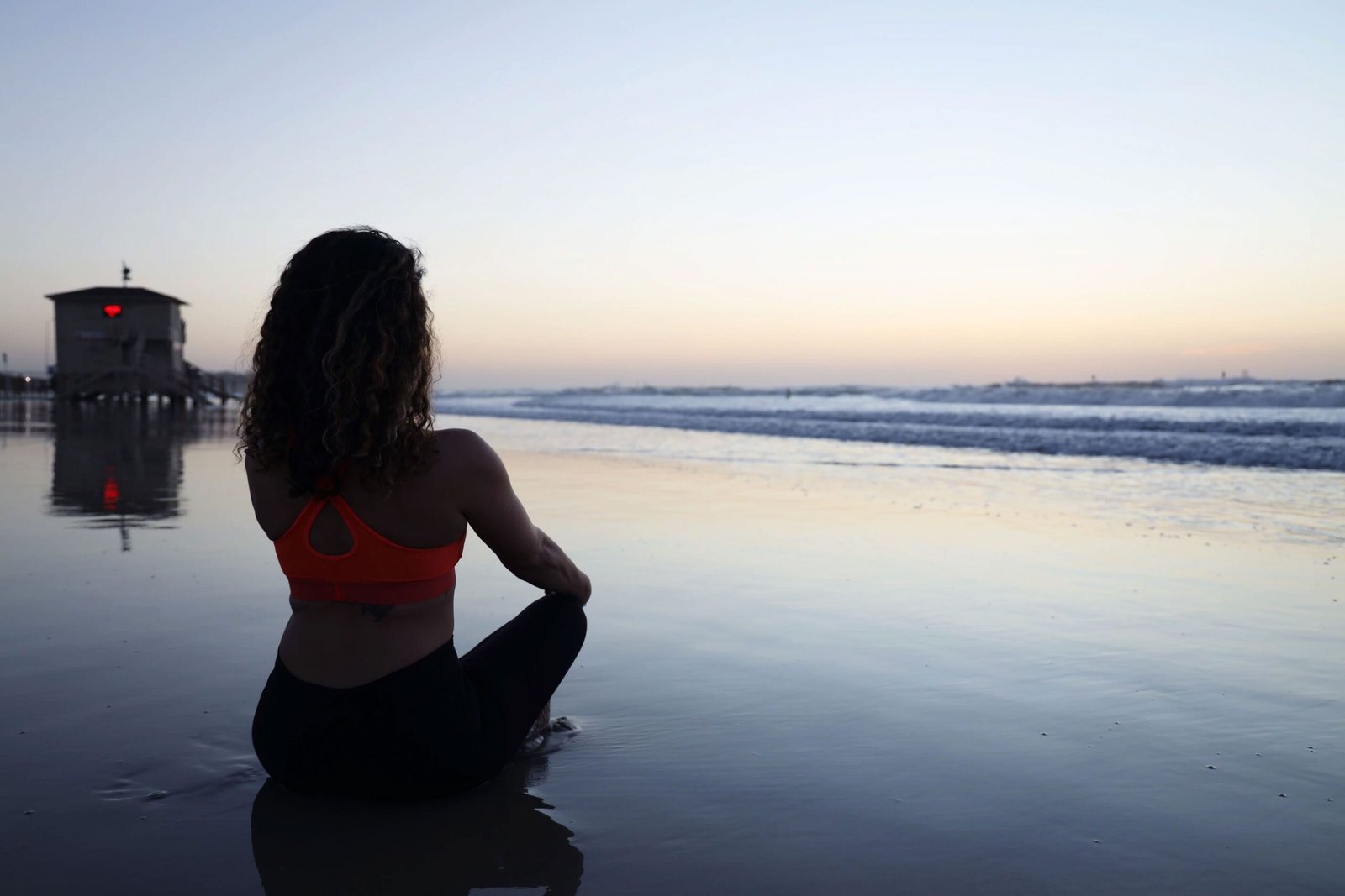 Woman Sitting on the Beach